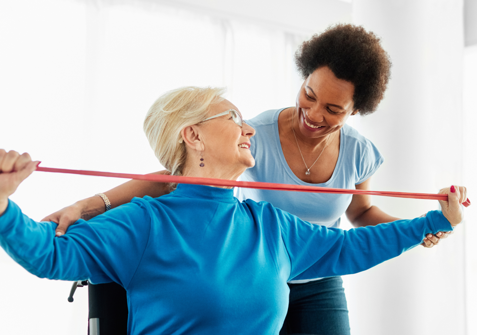 An older woman using medical equipment in physical therapy.